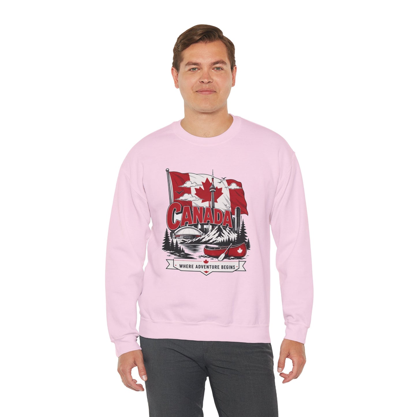 Pink crewneck sweatshirt worn by model, Canada flag and canoe logo on front