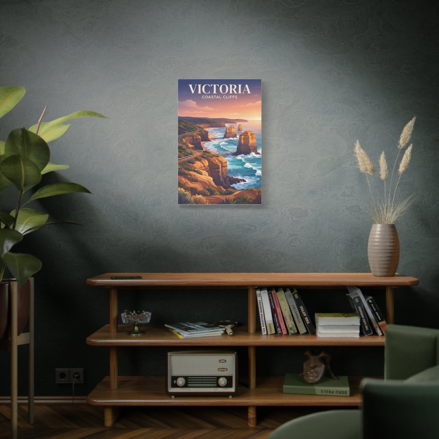 Vertical canvas wall art on a wall, showing coastal cliffs, sea spray, and sunset hues.