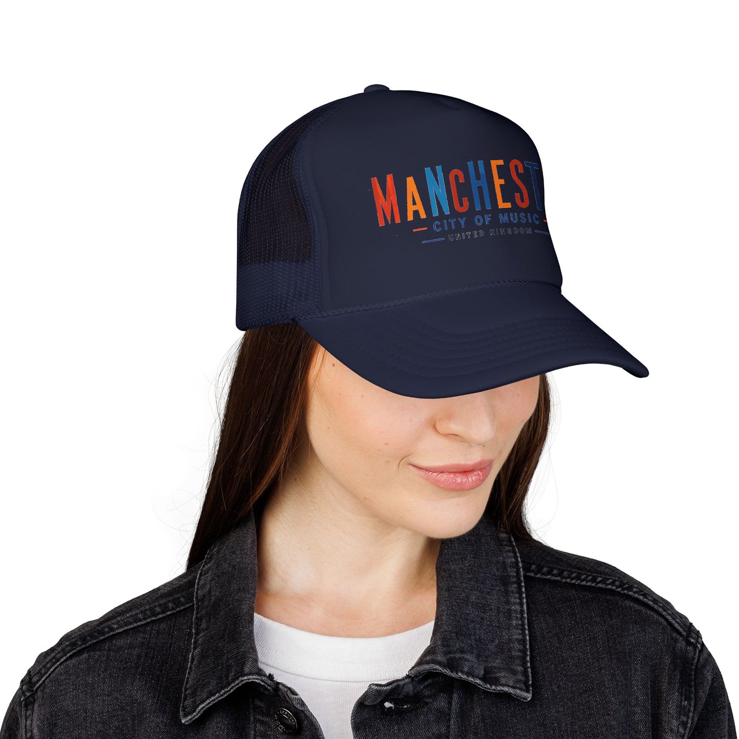 Navy trucker hat on model, side view with Manchester City of Music logo.