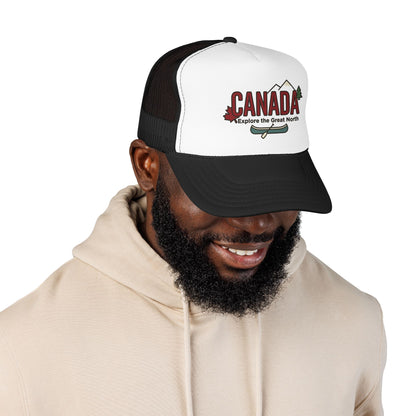 White foam trucker hat with dark mesh back and CANADA logo patch on front