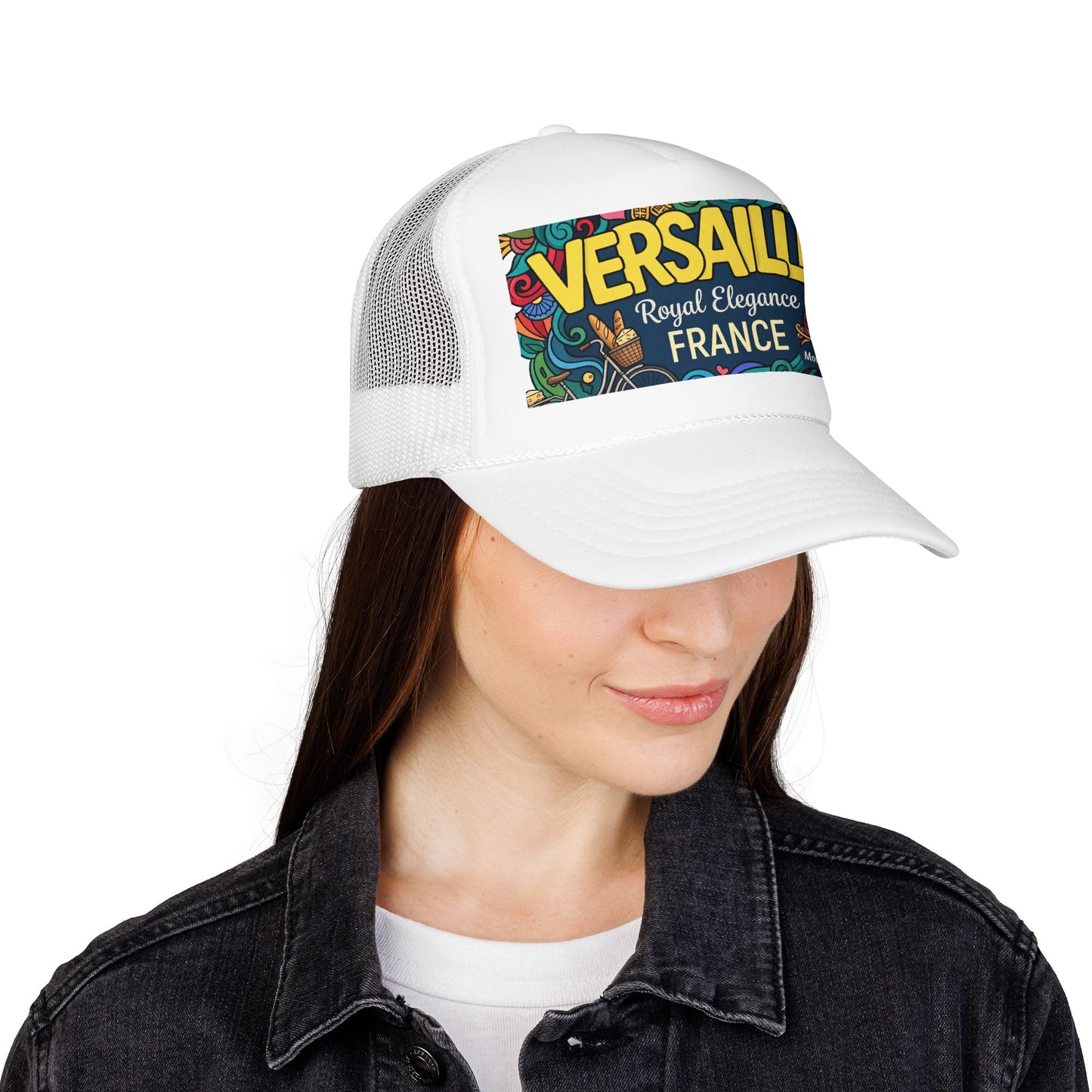 White trucker hat worn by a woman; “VERSAILLES” France graphic patch on front.