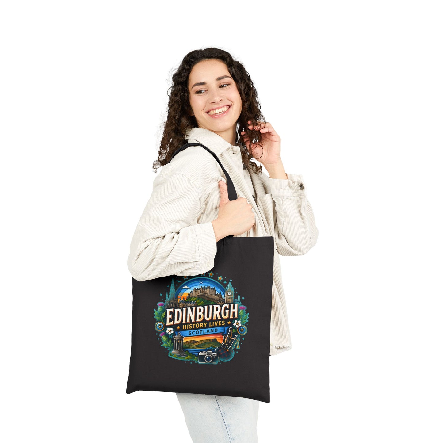 Black canvas tote bag worn on shoulder with Edinburgh history lives logo