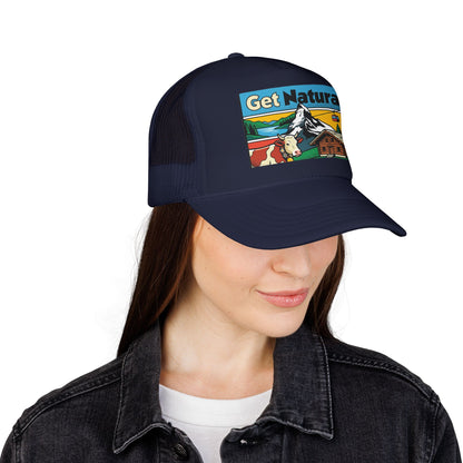 Dark navy trucker hat with Get Natural logo patch, worn with dark jacket