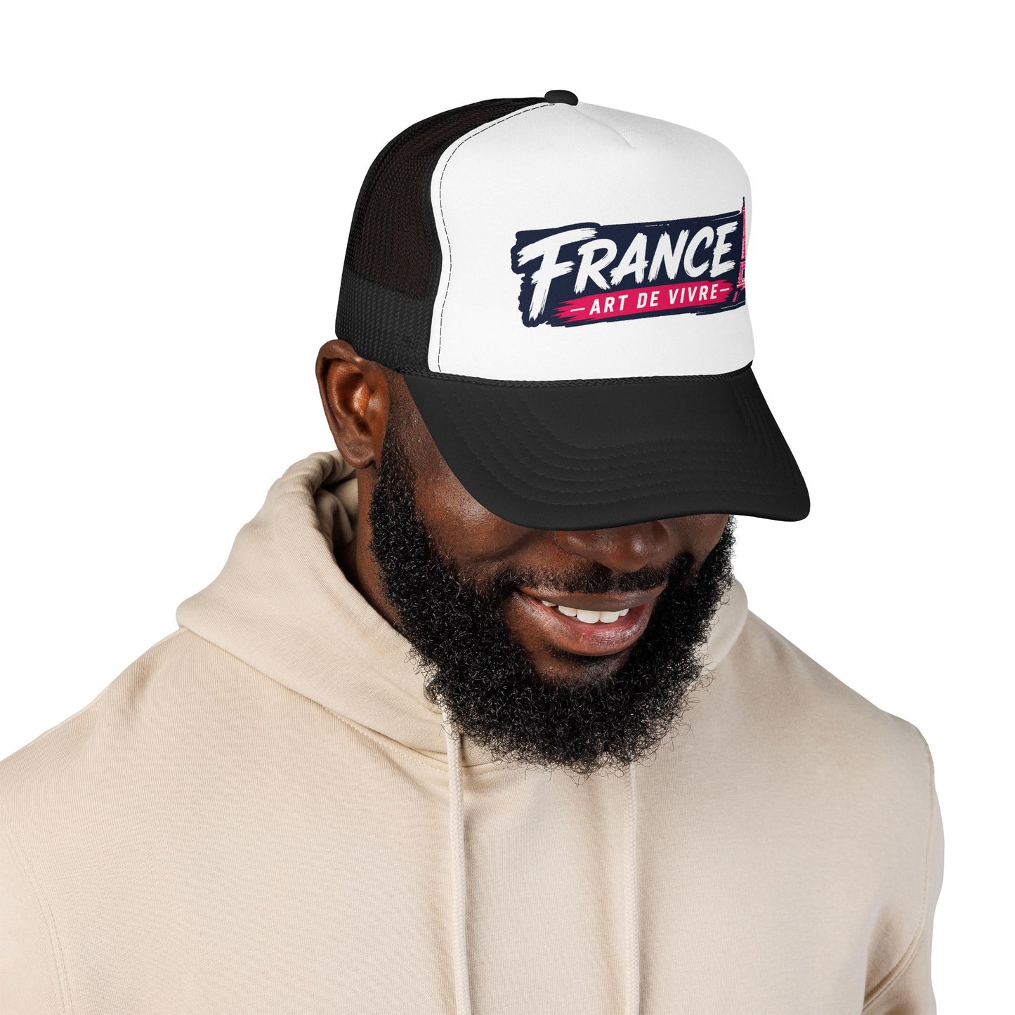 Black-and-white trucker hat with mesh back and 'FRANCE Art de Vivre' patch, worn