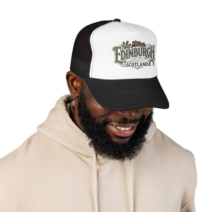 White front panel trucker hat with black mesh back and embroidered Edinburgh logo.