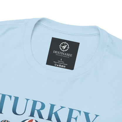 Light blue T-shirt, round neck, small chest tag and partial “TURKEY” graphic