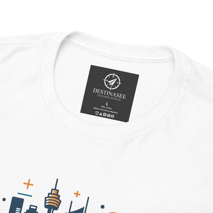 White T-shirt close-up: round neck label patch and partial colorful Sydney skyline print.