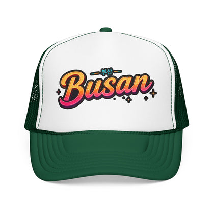White and dark green trucker hat with “Busan” front logo and curved brim
