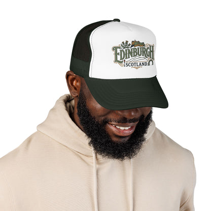 Dark green and white trucker cap with mesh sides, curved brim, and “Edinburgh Scotland” front logo.