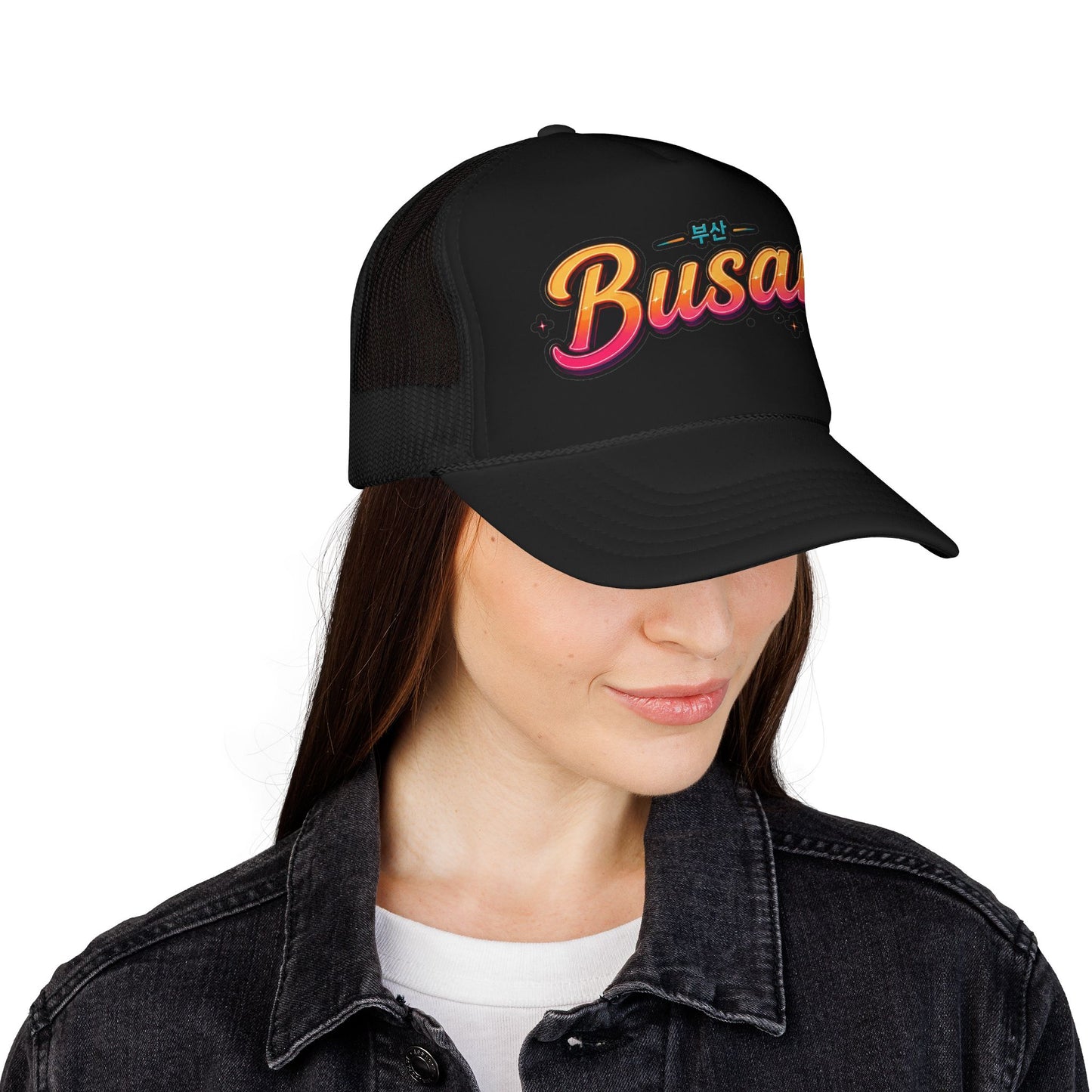 Black mesh trucker hat with “Busan” logo on front and curved brim