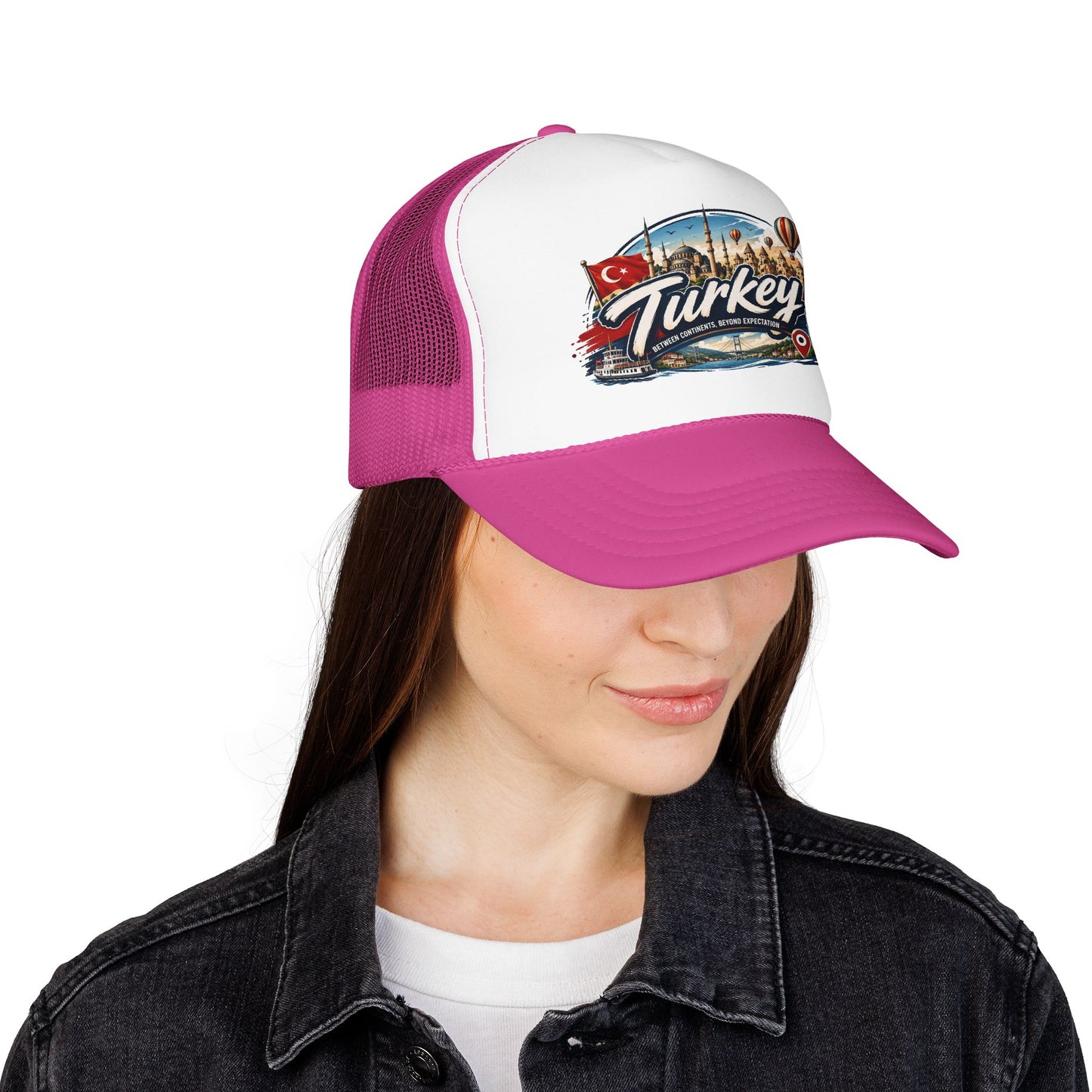 Turkey travel trucker hat with white front panel and magenta brim, worn by a woman
