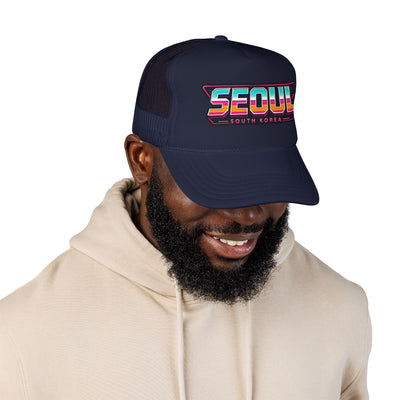 Dark navy trucker hat with mesh back and colorful SEOUL logo front patch