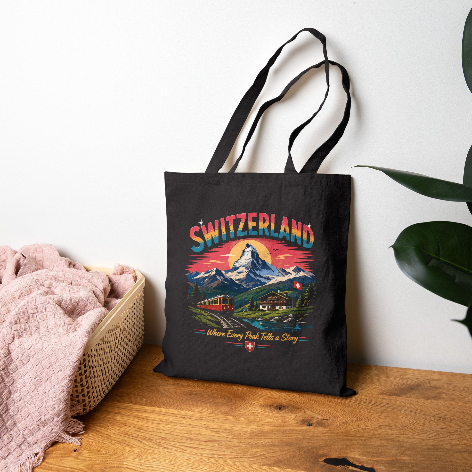 Black canvas tote bag featuring Switzerland graphic on front, long top handles.