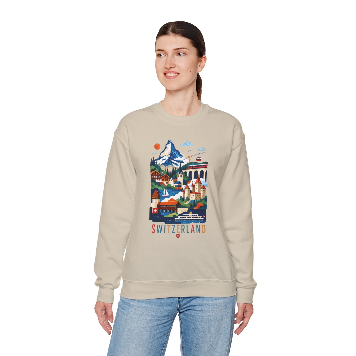 Beige crewneck sweatshirt with colorful Switzerland landscape graphic on front.