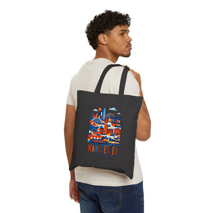 Black cotton tote bag with long handles and Manchester skyline graphic front.