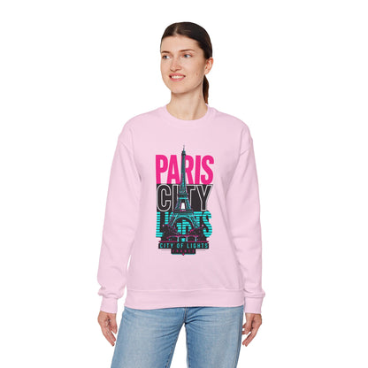 Light pink crewneck sweatshirt worn by model, featuring PARIS CITY Eiffel Tower lights graphic.