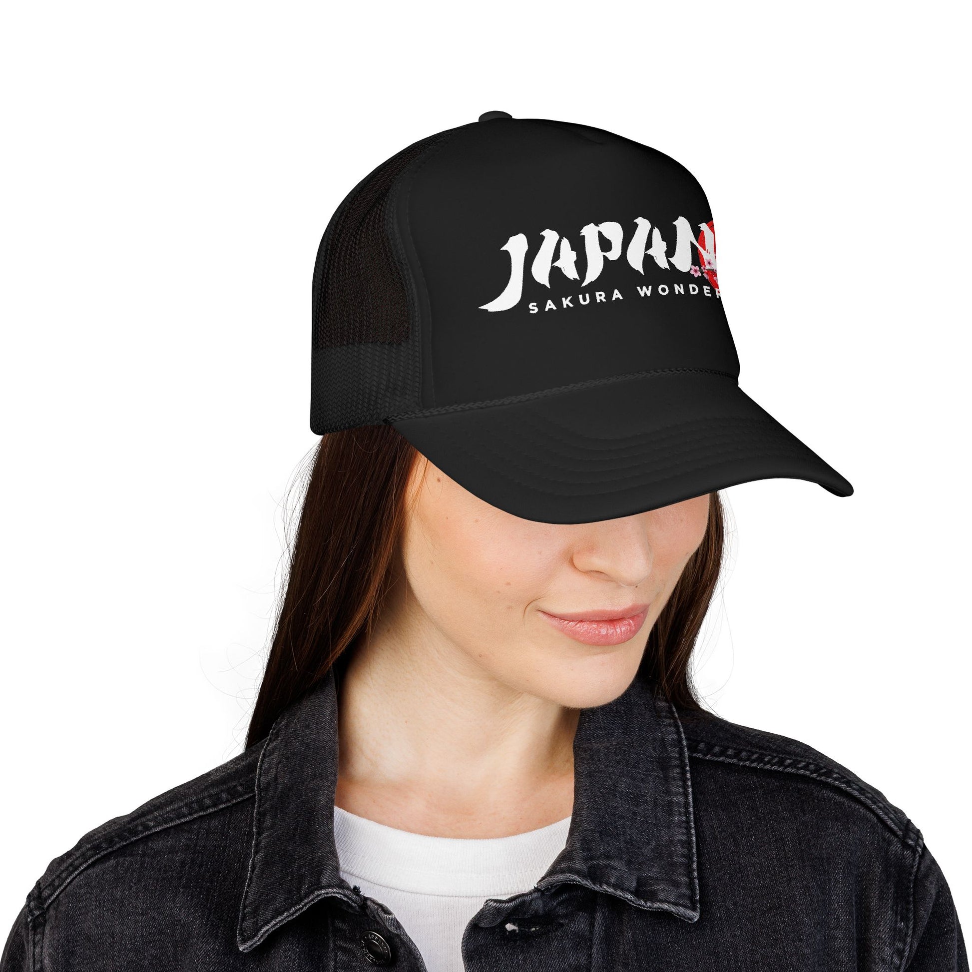 Black trucker hat worn by a person, front logo visible above dark jacket.