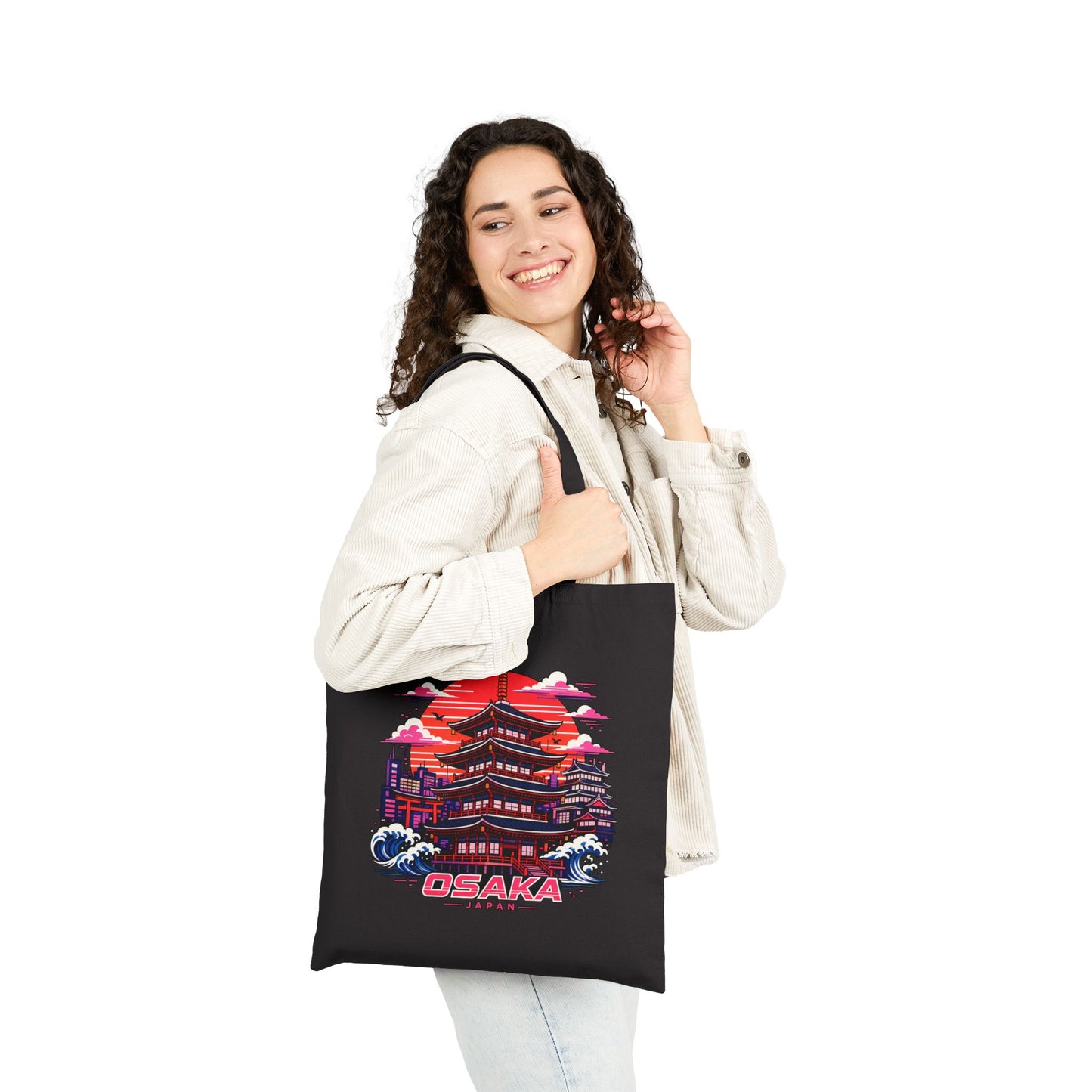 Black cotton tote bag with Osaka graphic held by a woman