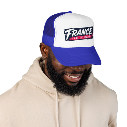 Blue and white mesh trucker cap with curved brim and “FRANCE” graphic