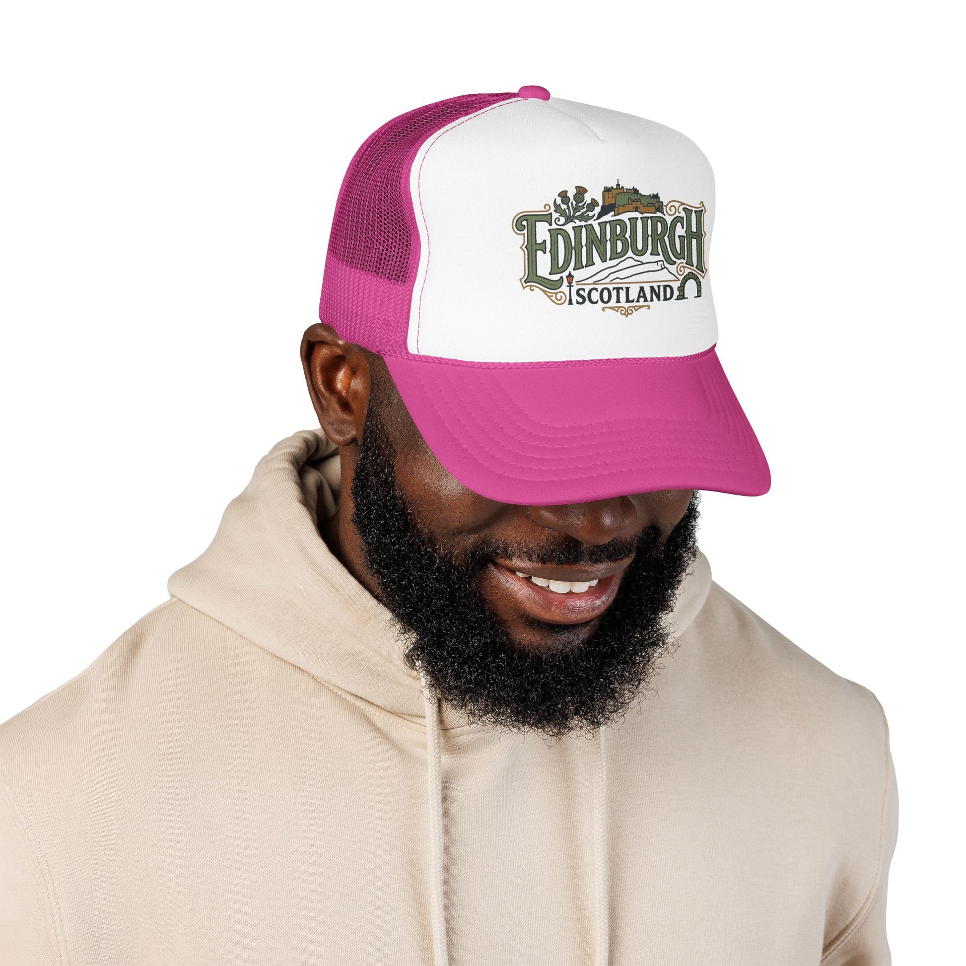 Pink and white trucker cap with mesh sides, curved brim, and “Edinburgh Scotland” front logo.