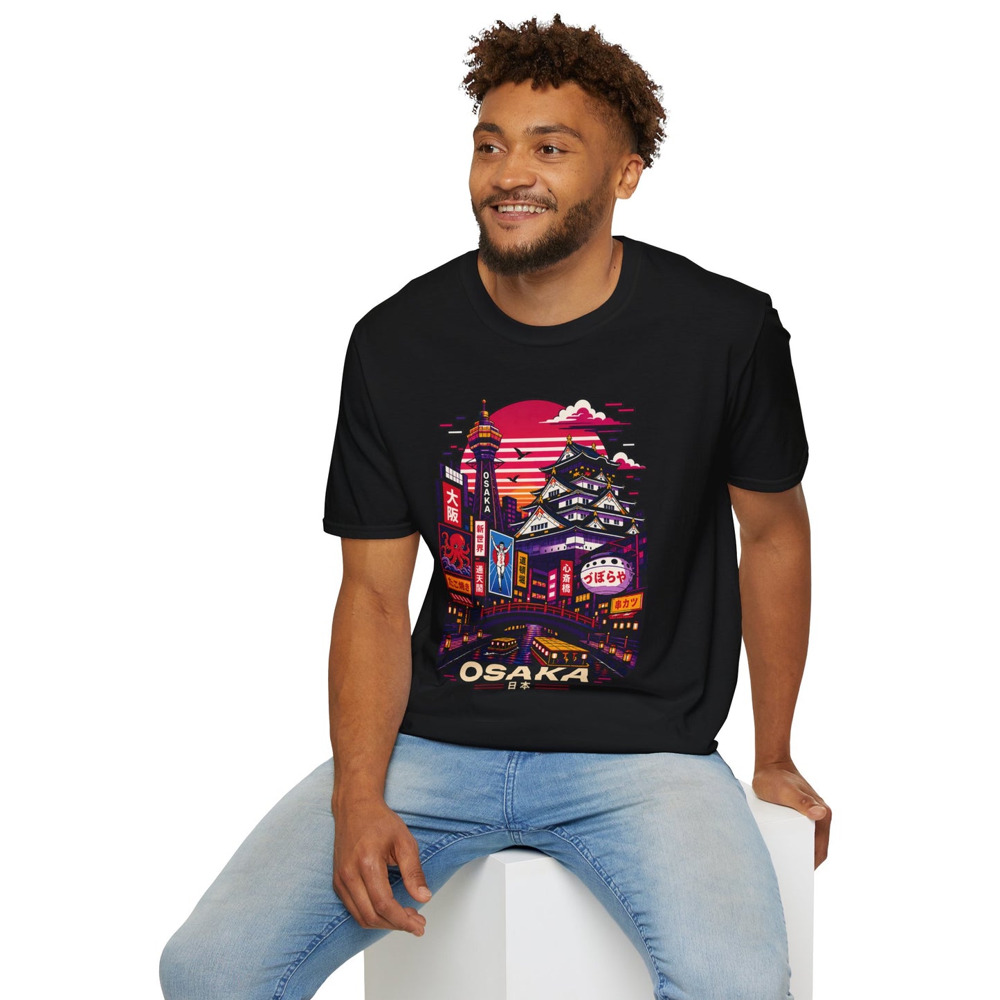 Black T-shirt with Osaka neon cityscape print, worn by a man sitting