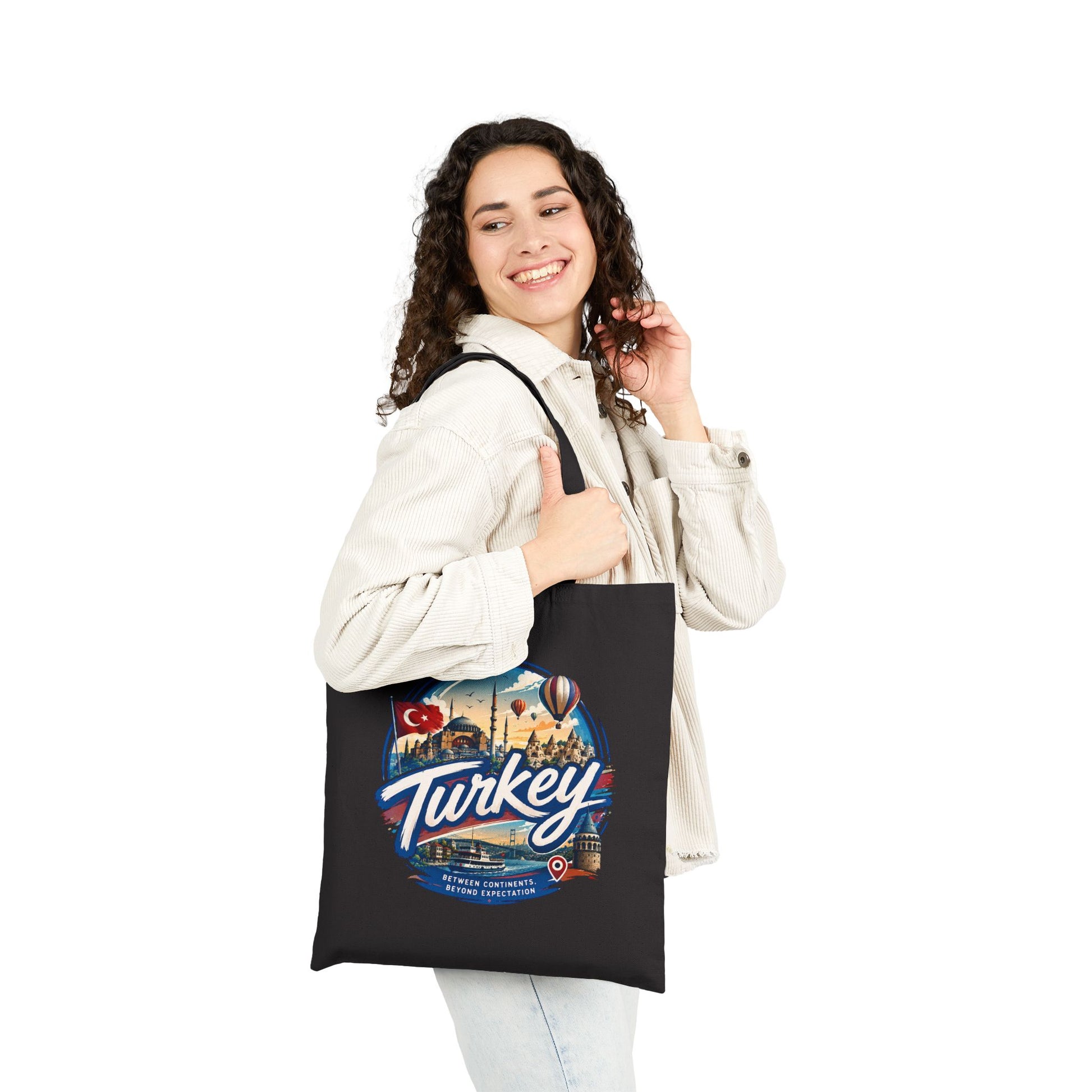 Black tote bag with long handles and Turkey scenic graphic on front
