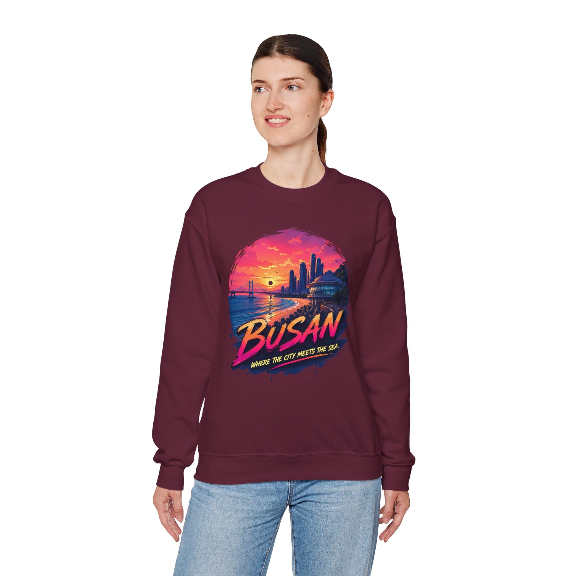 Maroon crewneck sweatshirt with Busan sunset graphic on chest