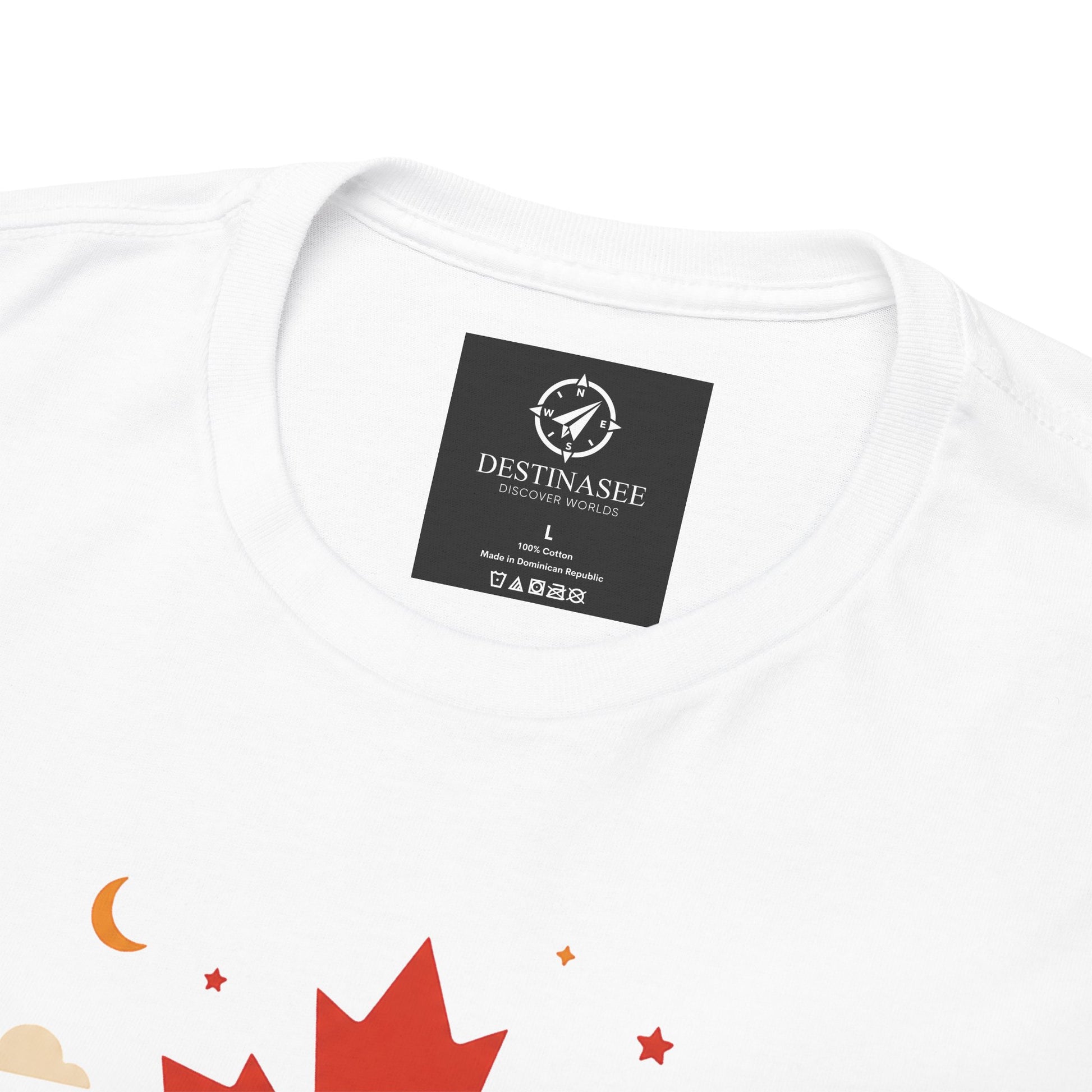 White T-shirt close-up with neck label and partial colorful stars and maple leaf graphic