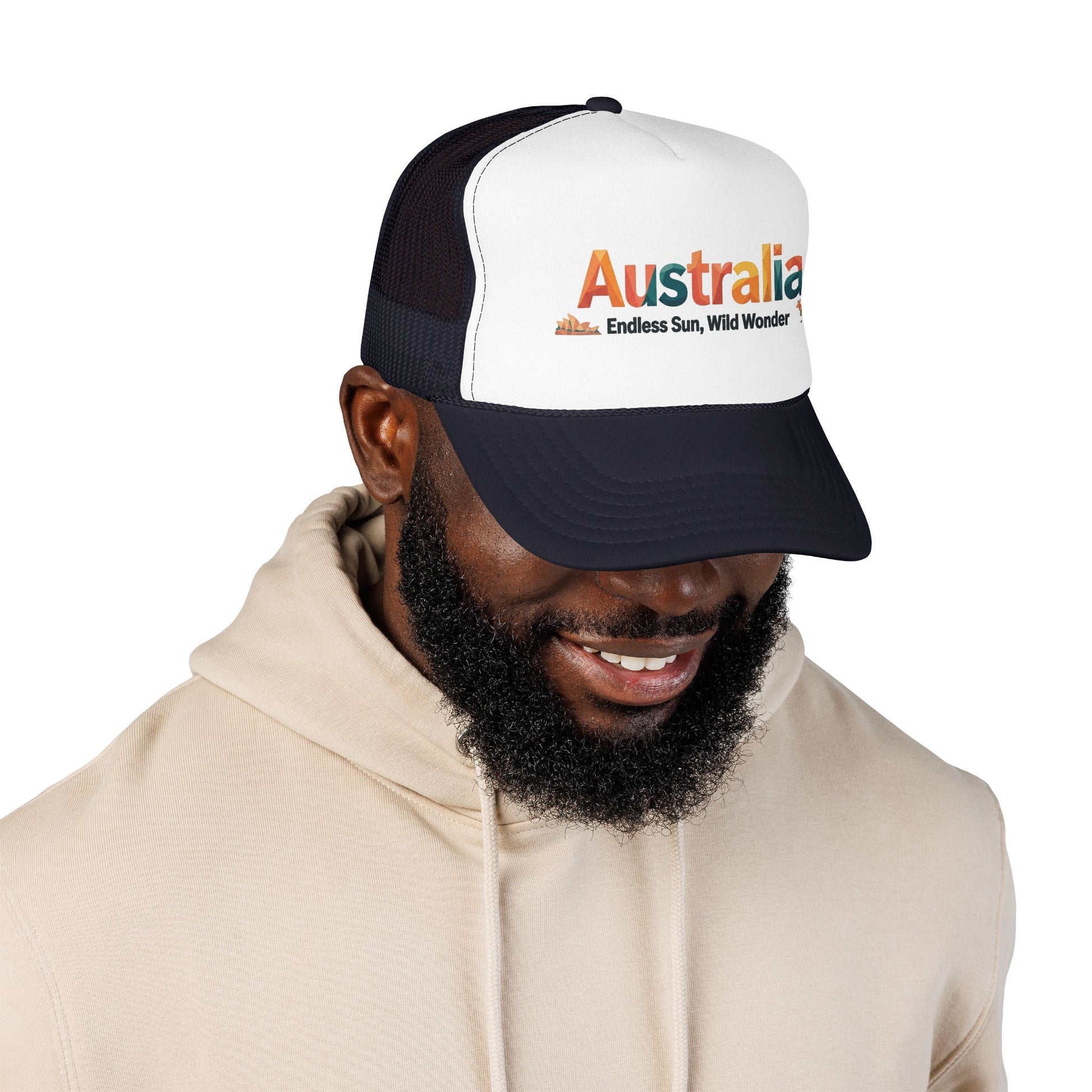 Black-and-white trucker cap with orange Australia logo, worn by model