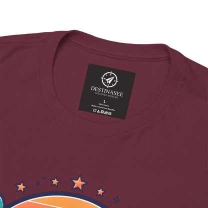Maroon T-shirt with “Destinasee” neck label and multicolor star sunrise graphic