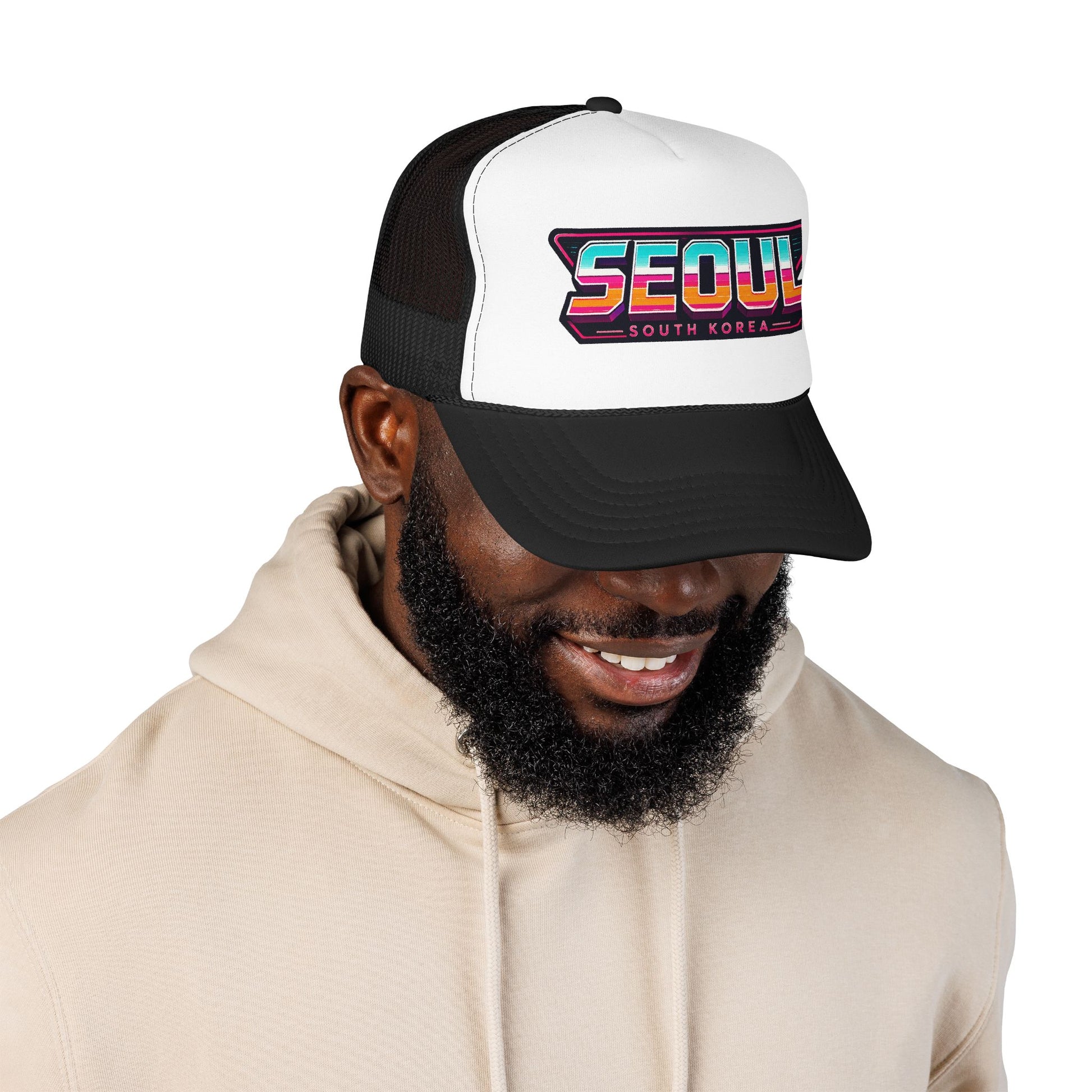 Black and white trucker hat worn by man, side view of Seoul logo graphic