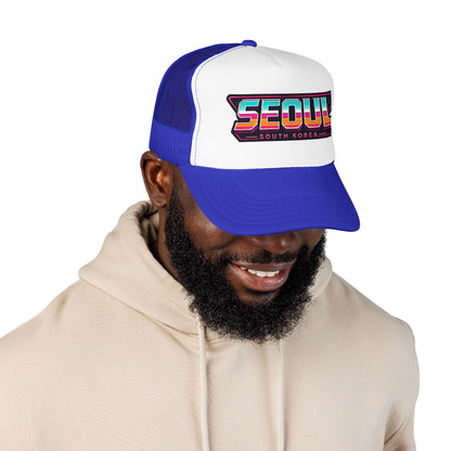 Blue and white trucker hat with “SEOUL SOUTH KOREA” front logo patch on mesh back.