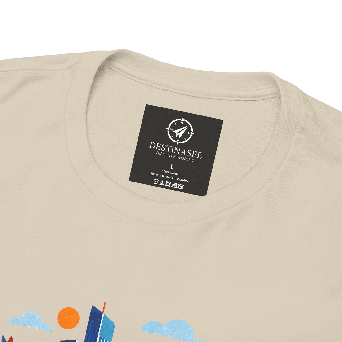 Light beige t-shirt close-up with crew-neck label and partial skyline print