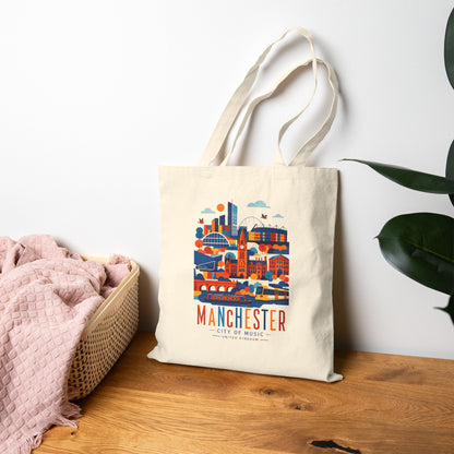 Natural cotton tote bag with long handles and Manchester skyline graphic front.
