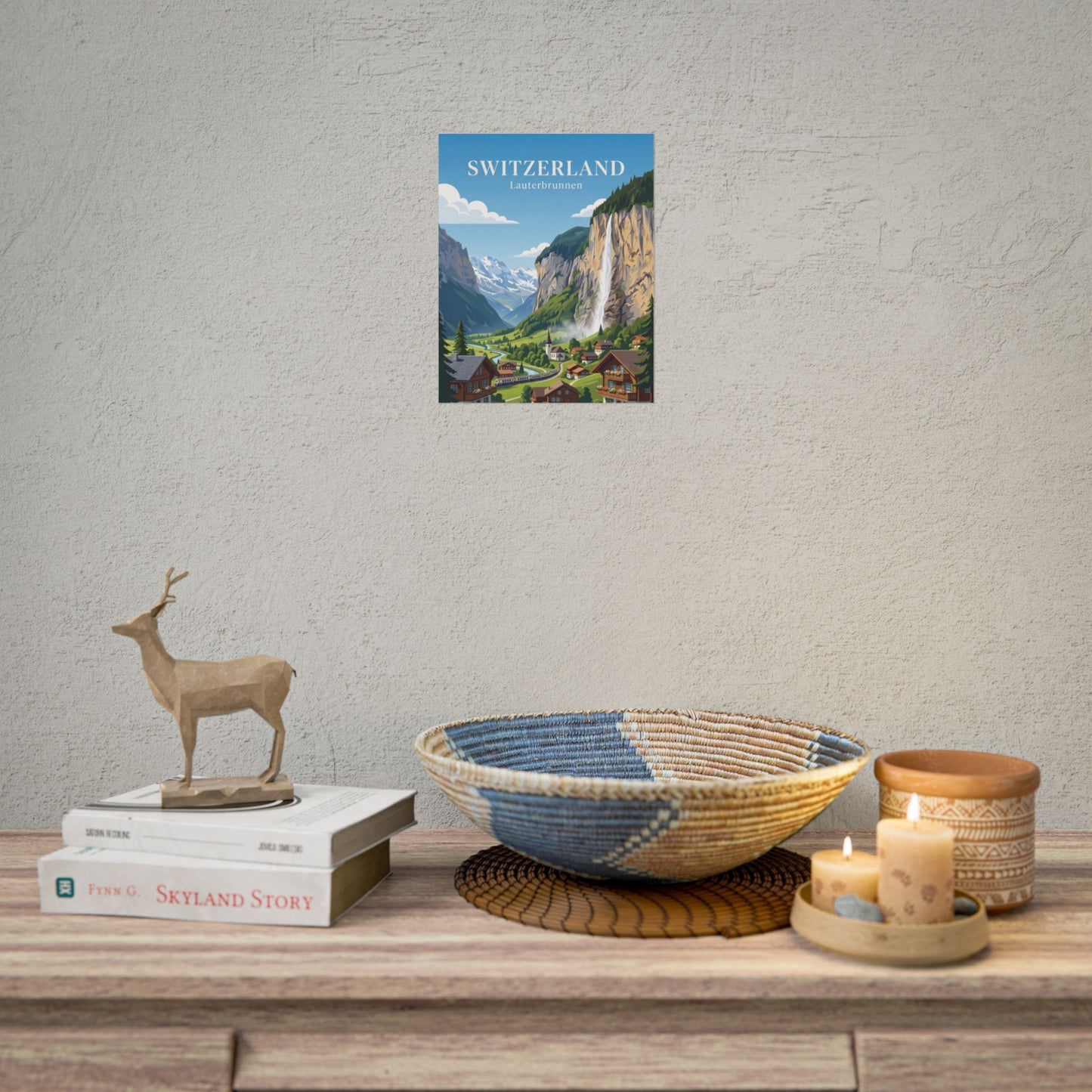 Rolled poster showing Switzerland title, Lauterbrunnen village, waterfall, and green valley