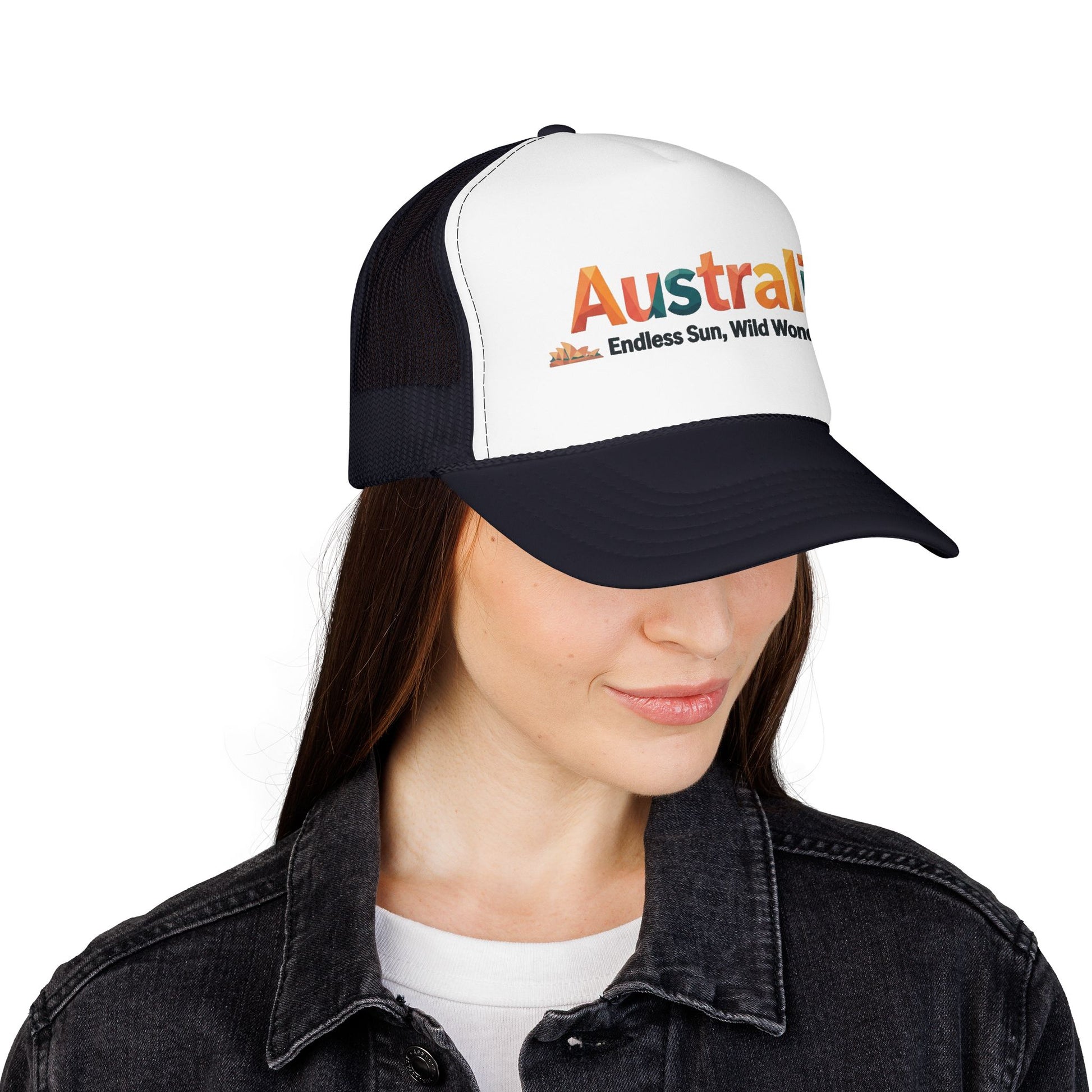 Black-and-white trucker cap with orange Australia logo, worn by model