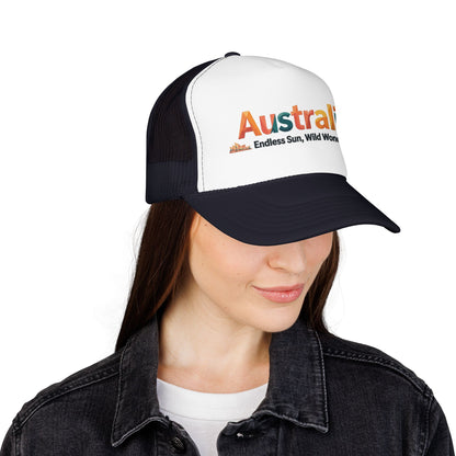 Black-and-white trucker cap with orange Australia logo, worn by model