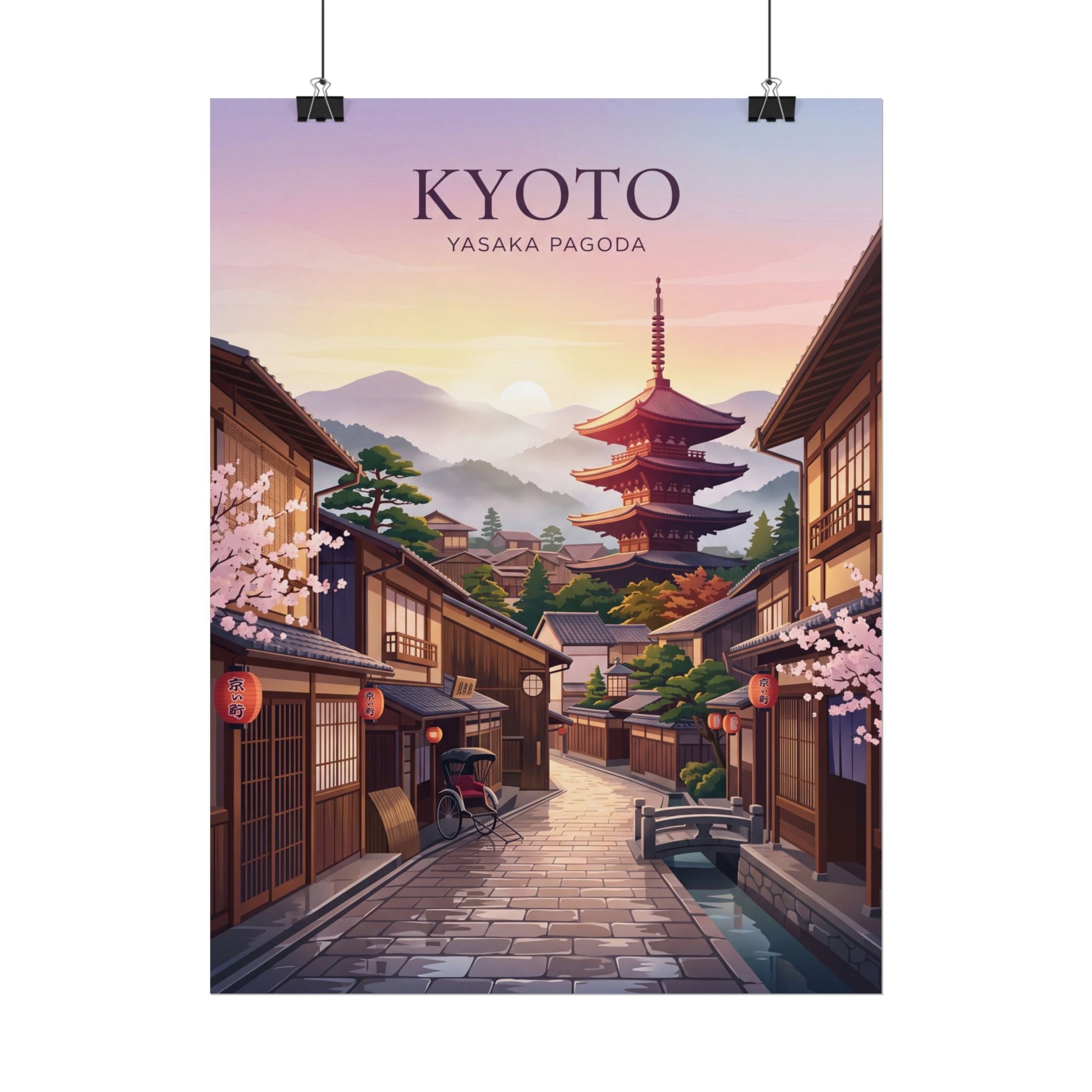 Rolled poster on clips: Kyoto street with Yasaka Pagoda tower, sunset sky and town buildings.