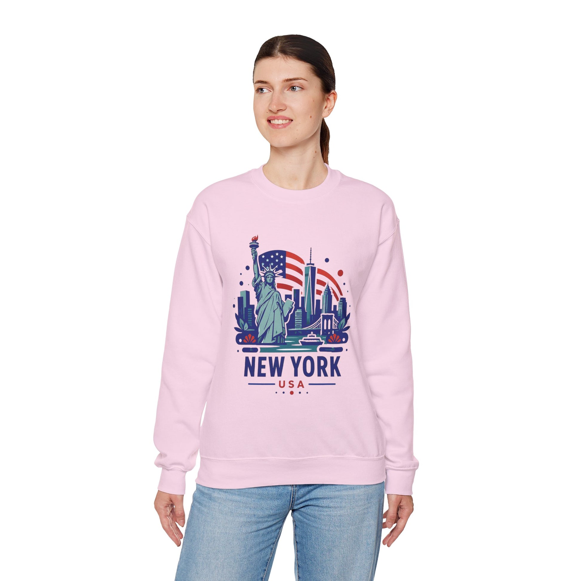 Pink crewneck sweatshirt with New York USA front graphic, worn by a woman