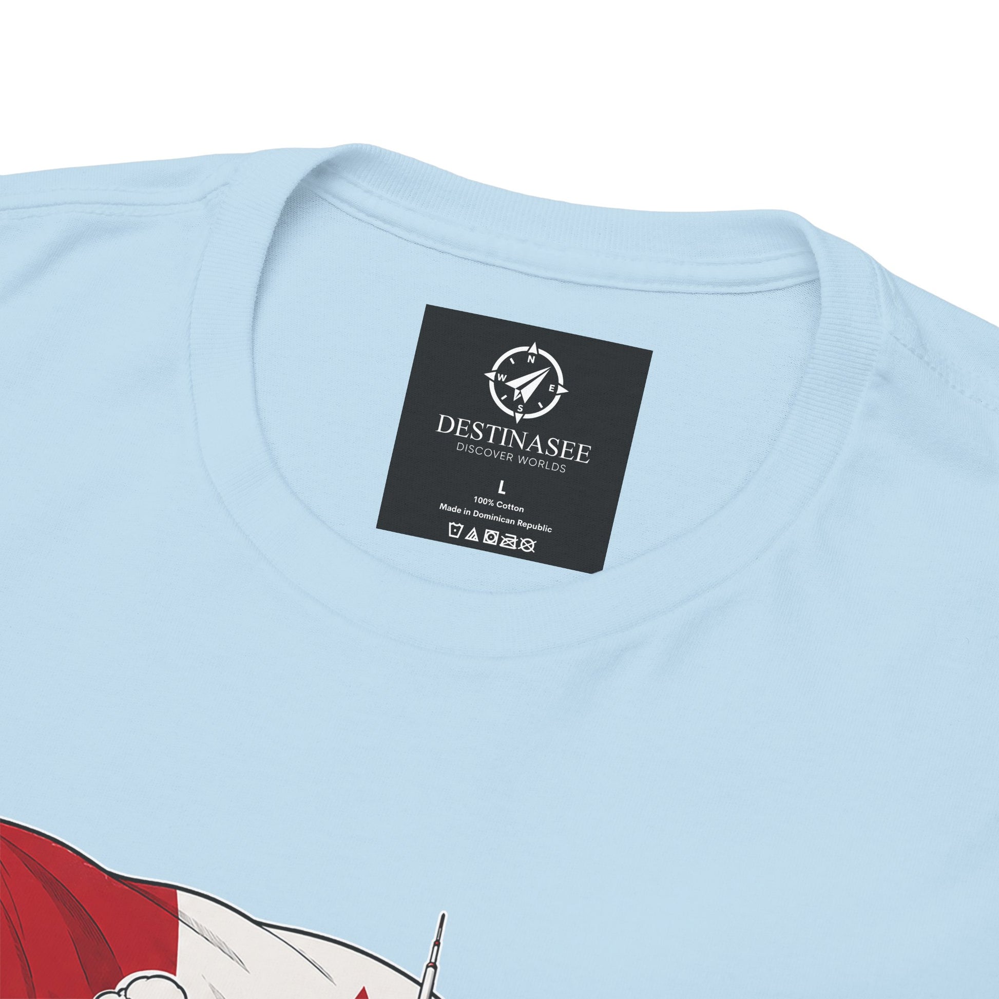 Light blue crewneck t-shirt with “DESTINASEE” label at the back neck
