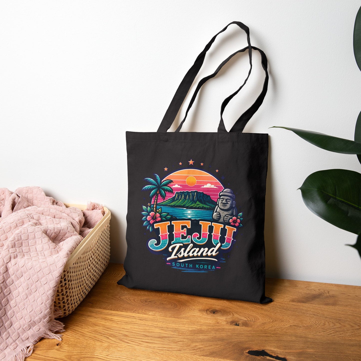 Black tote bag with colorful Jeju Island graphic and long canvas handles