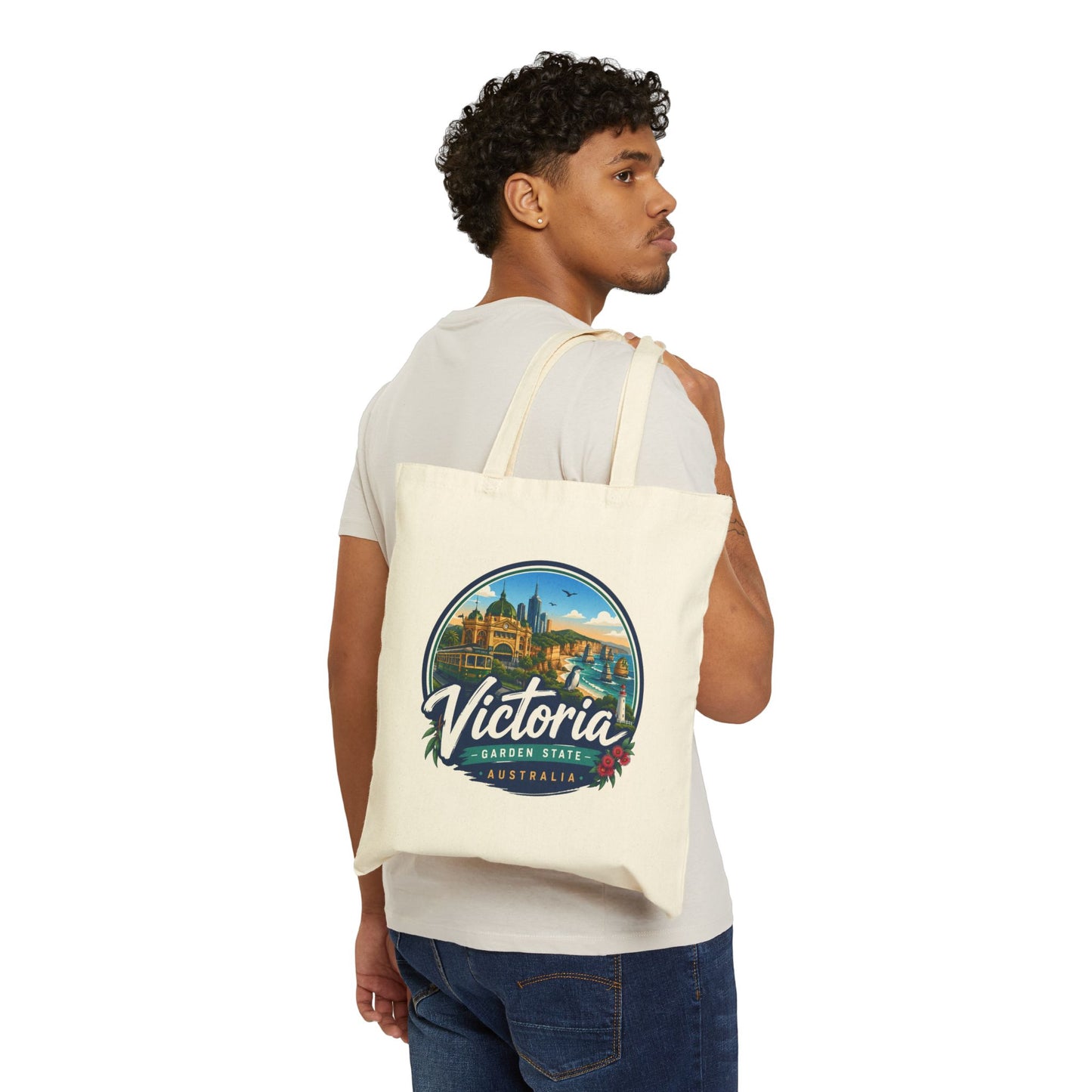 Natural vintage travel tote bag worn on shoulder, featuring circular Victoria Australia logo