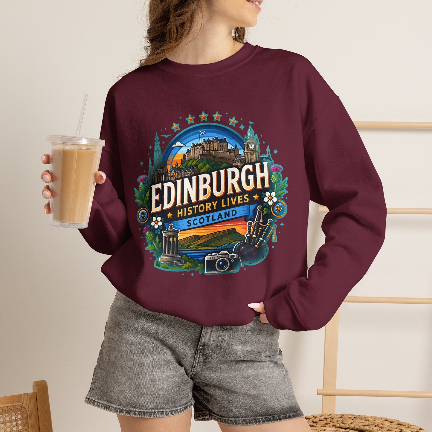 Maroon crewneck sweatshirt with colorful Edinburgh graphic print on front