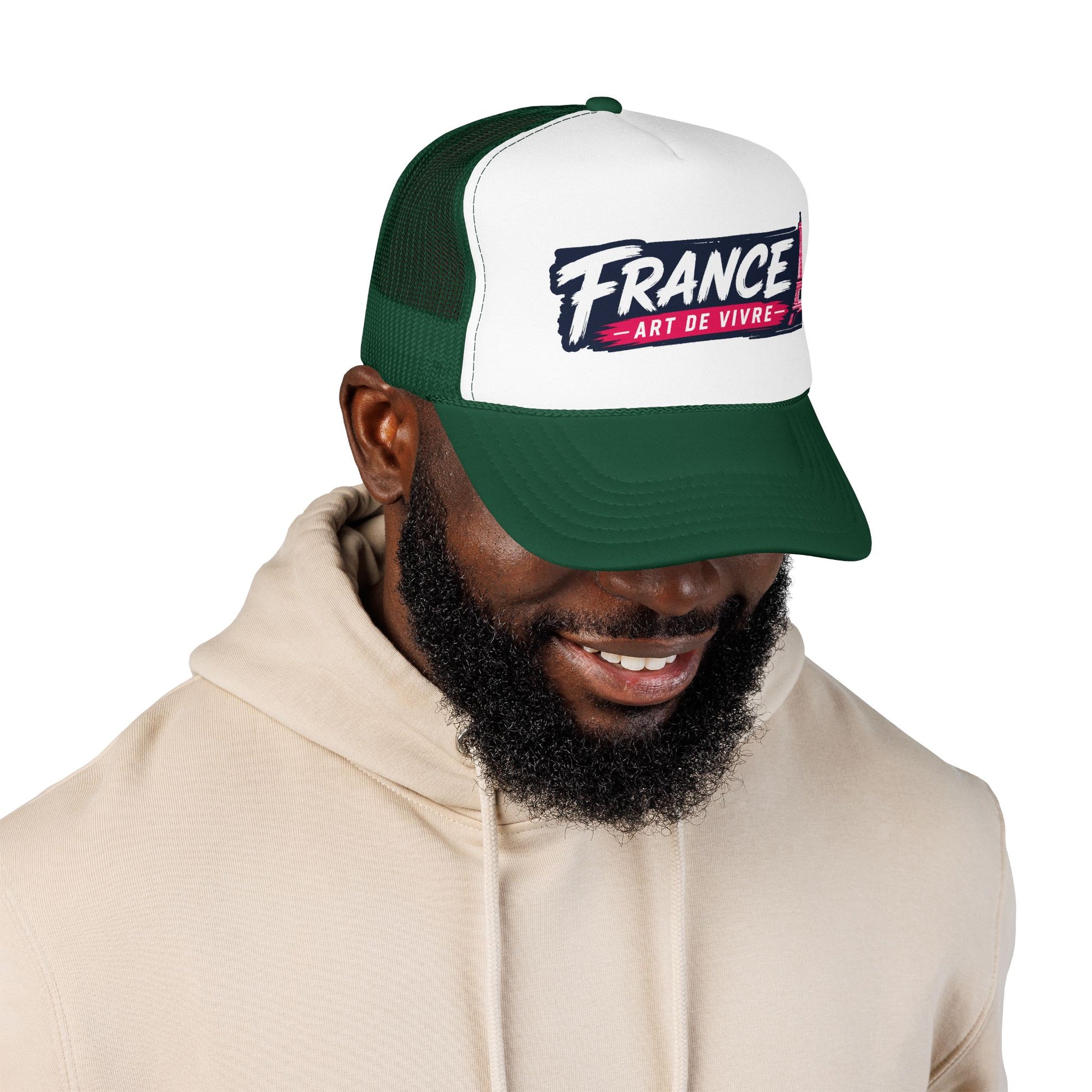 Green and white trucker hat with mesh back and 'FRANCE Art de Vivre' front patch on model