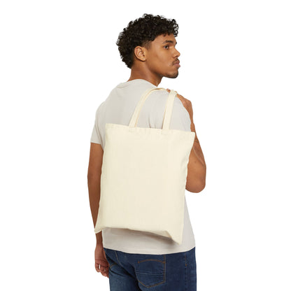 Natural canvas tote bag worn on shoulder, solid blank front panel