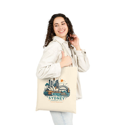 Natural canvas tote bag with Sydney Harbour City graphic, worn on one shoulder