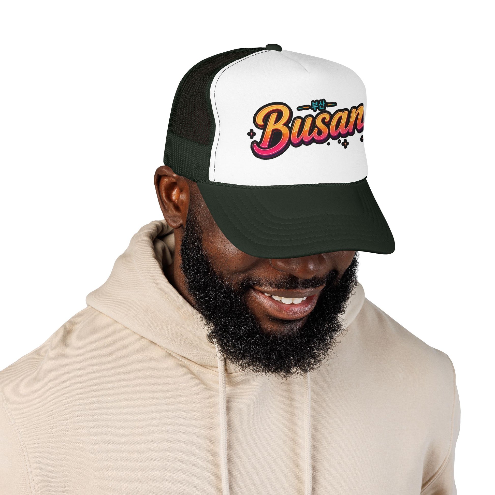 Dark green and white trucker hat with 'Busan' logo on front panel