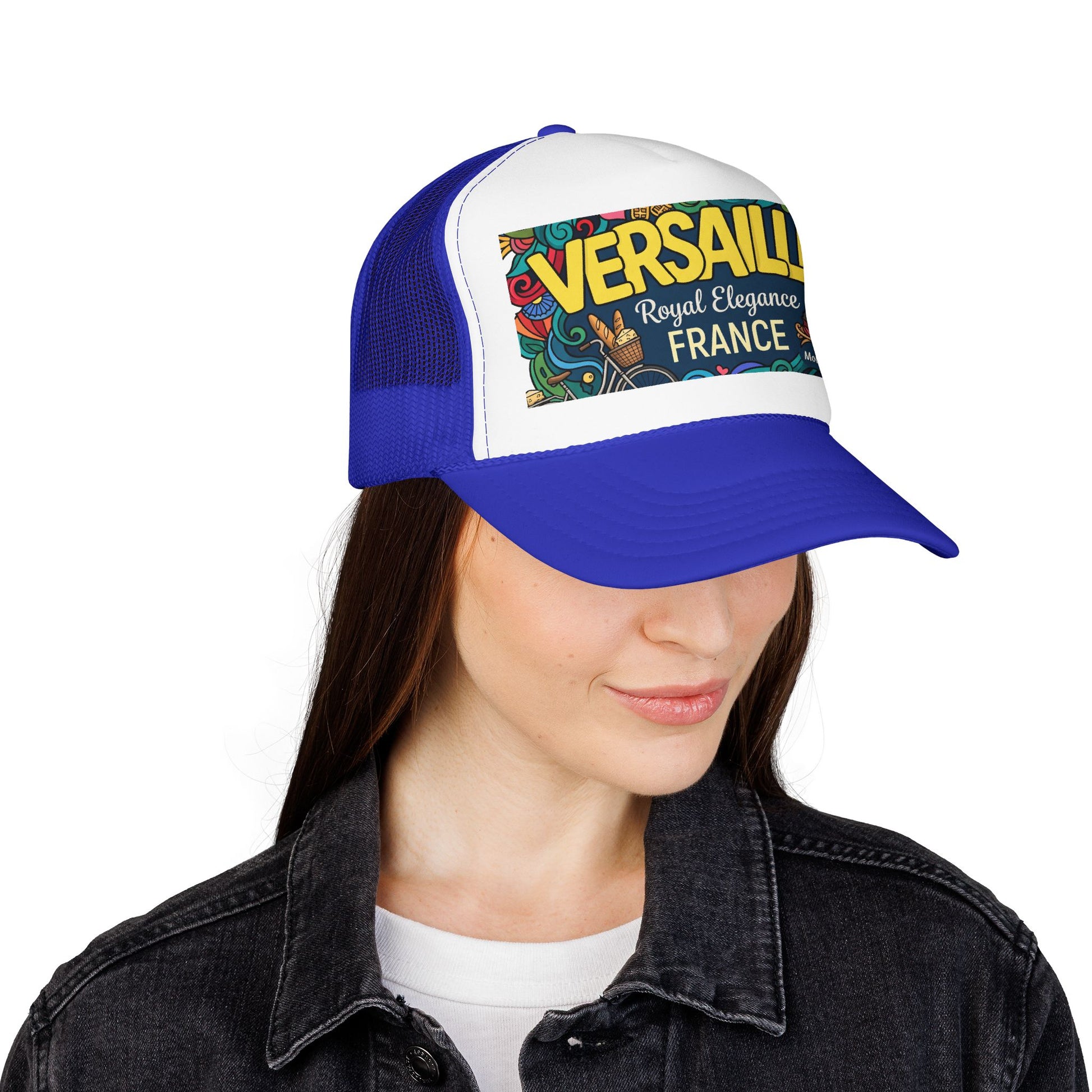 Royal blue and white trucker hat with mesh sides and 'Versailles France' front patch worn by model