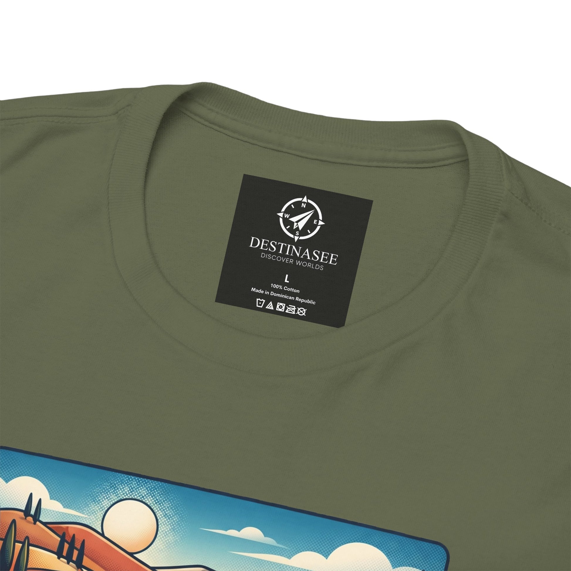 Olive green crewneck T-shirt with black brand neck label and partial “DESTINASEE” graphic