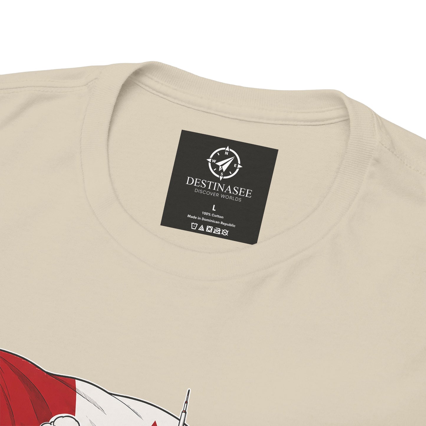 Natural beige T-shirt back with black logo patch; partial red canoe graphic